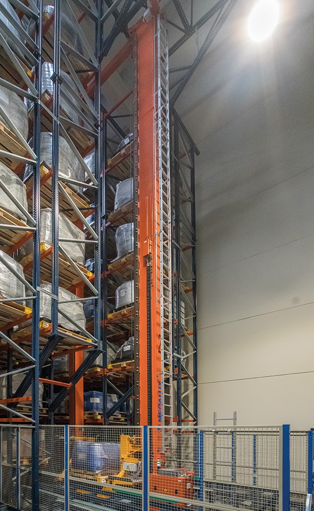 Two single-mast stacker cranes, one in each aisle, move pallets between the racking locations and the input and output conveyors